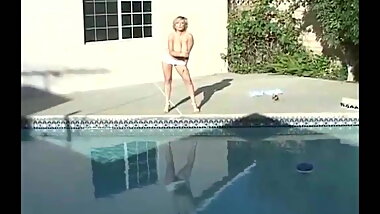 Danni Ashe Strips Down At Poolside
